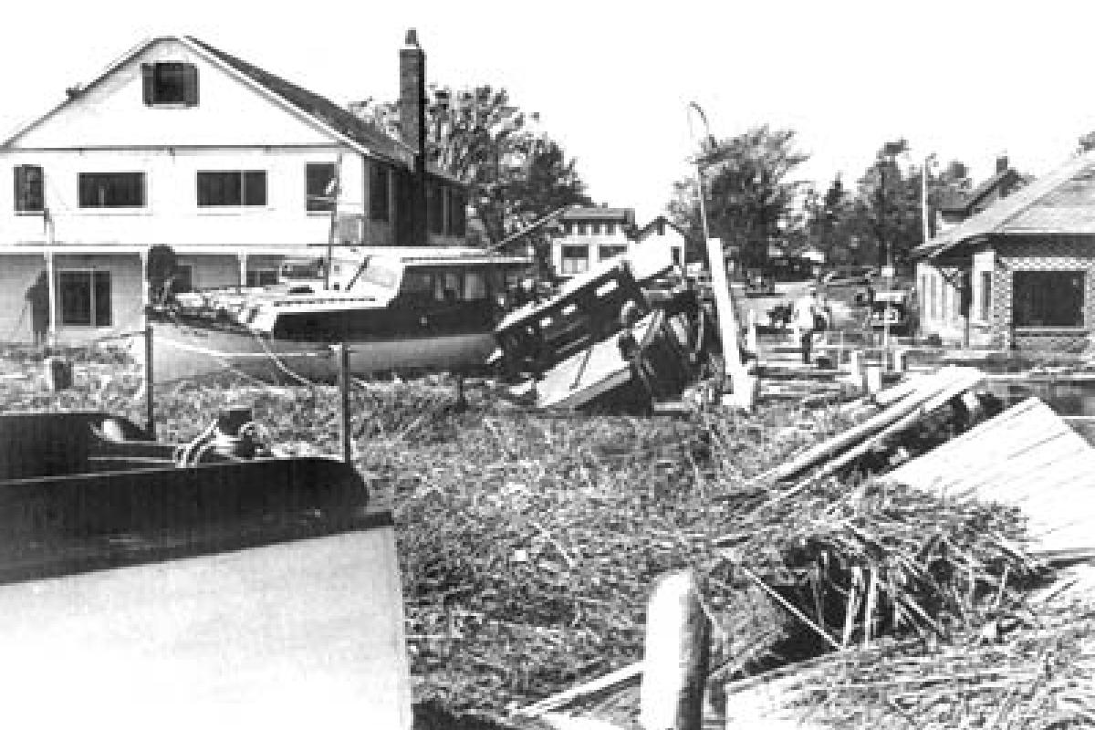 Novelty Lane. September, 1938 Hurricane damage. 1936 Essex Yacht Club on left. Circa 1850 Gladwin/Wooster house in center (torn down in 2000).