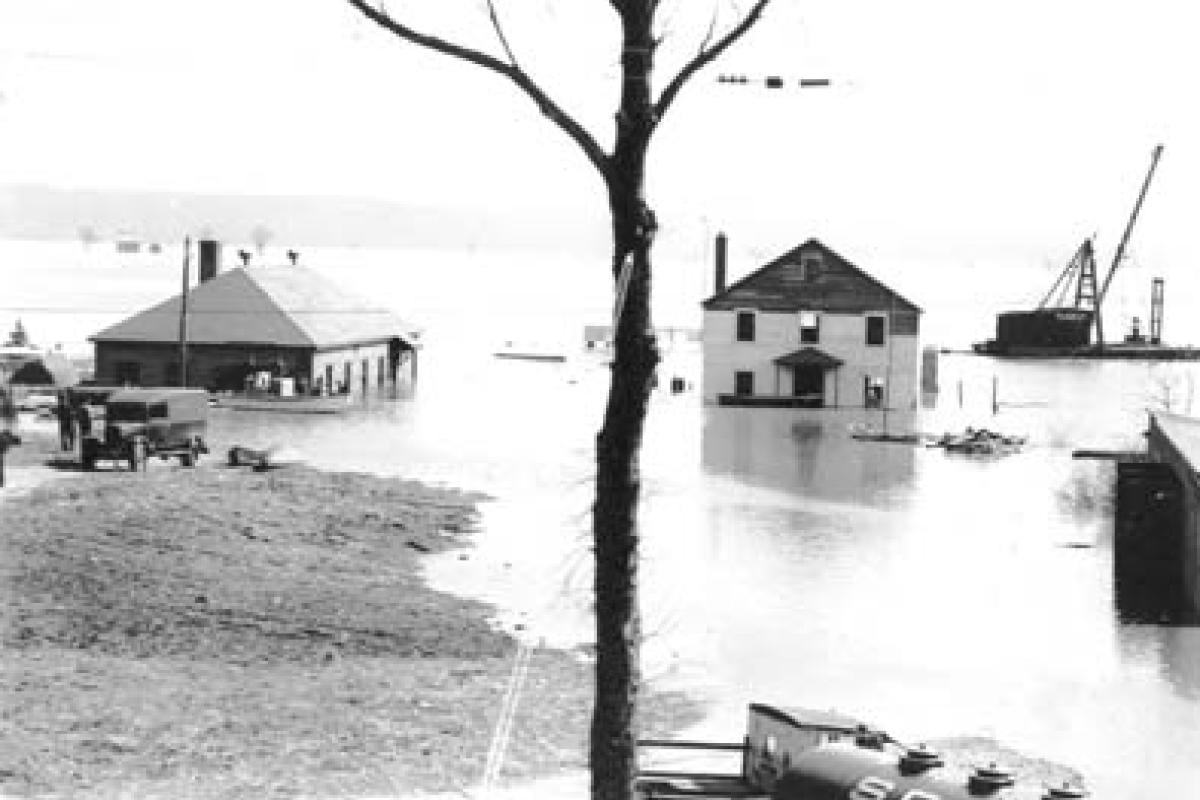 March 30, 1936 photo of Connecticut River flood. Essex Yacht Club (Corinthian) at right - Essex Paint & Marine Company on left..